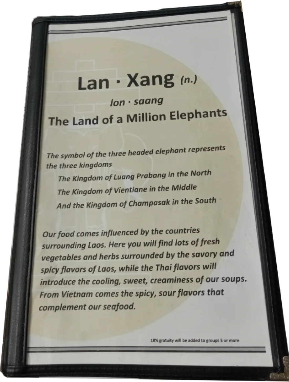 Before: the old Lan Xang menu, plain black text on a cream circle inside a worn black menu folder.